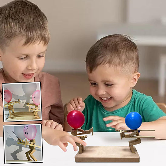 2 garçon s amuse intensémenet sur leur jeu de société à 2 de bataille d escrime balloune