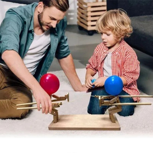un pere et son fils partage un moment de complicité avec son fils avec un jeu de société à 2 complètement loufoque