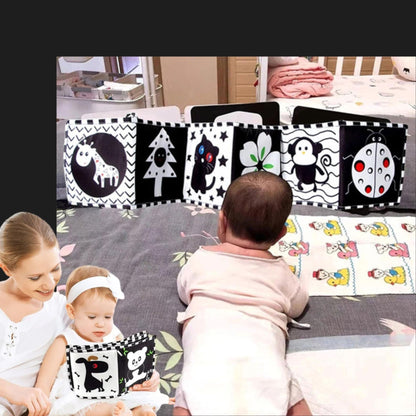 tour de lit noir et blanc livre pour bébé axé sur le conffort visuel et des contrastes