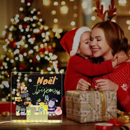 une jeun fille remerci d amour sa mere pour le cadeau de Noël qu'elle vient de recevoir le tableau lumineux à dessin 
