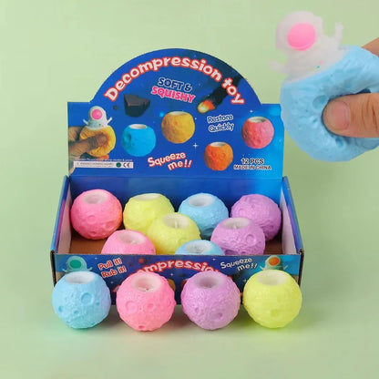 boîte de présentation de balles anti stress de balle de lune cachant un astronaute à faire sortir en pressant