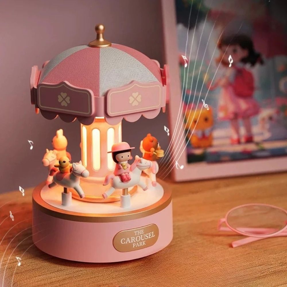 un carrousel de poupée rosé et doré comme boite a musique et lumiere de chambre douce