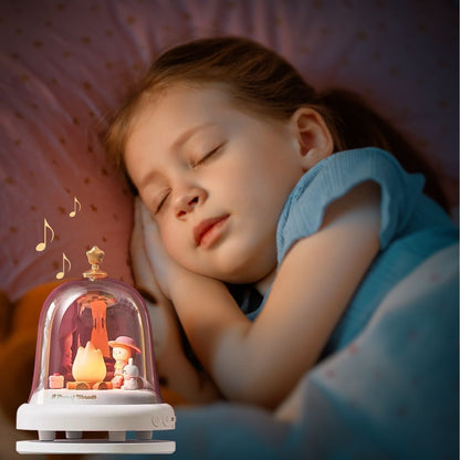 une fillette dort profondément en ecoutant sa boite a musique et a la lueur de sa veilleuse enfant