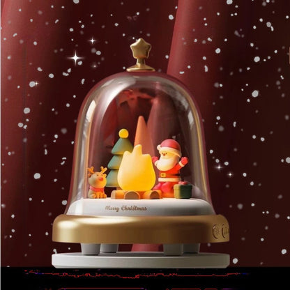 une boite a musique en forme de cloche de verre avec le père Noël et la flamme de la veilleuse ajustable