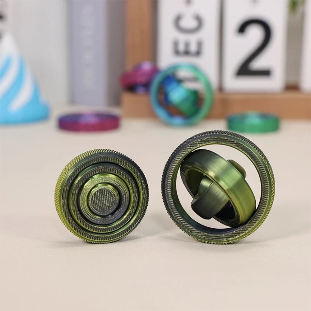 boule anti stress   vert gyroscope 4 anneaux