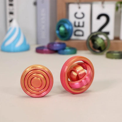 boule anti stress orange gyroscope 4 anneaux