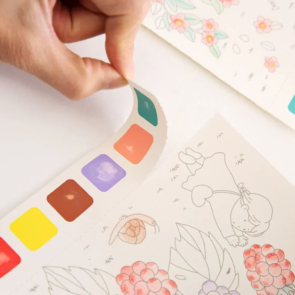 le cahier de dessin magique retirer la bande d'aquarelle et admirer votre art