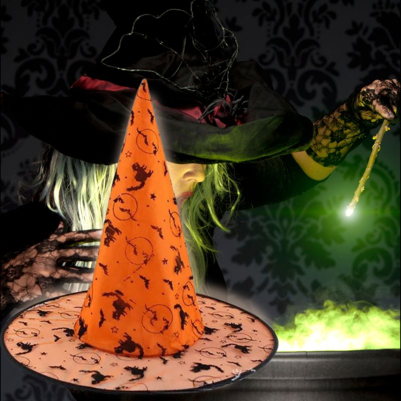 Une sorcière concocte son brouet a côté ndu chapeau de sorcière orange avec chat noir