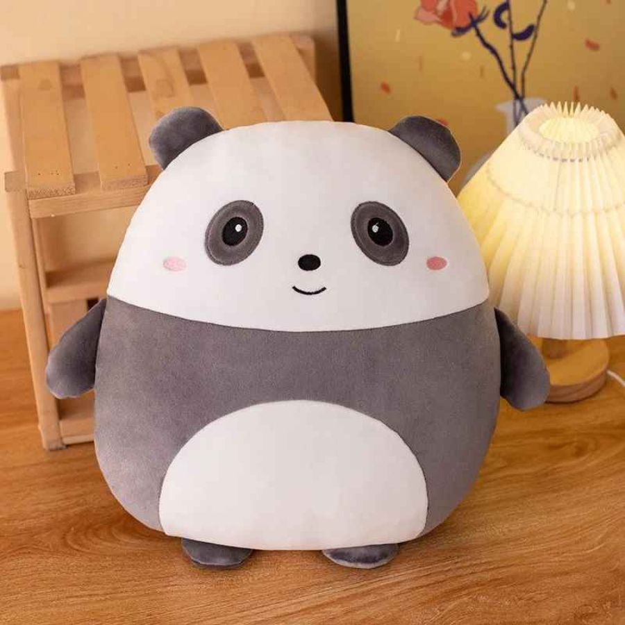 un modèle de coussin enfant en forme de panda rond est aussi une oreiller, une peluche un ami