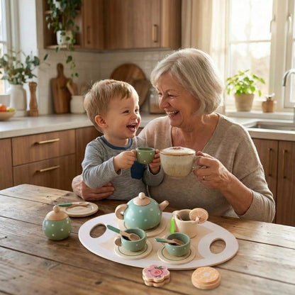 grand-mère bois son café avec son petit fils qui joue avec son service de thé de sa dinette en bois.il adore imiter mamie.