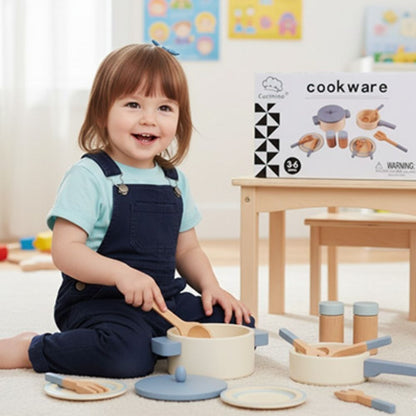 fillette de 3 ans entrain de jouer avec sa dinette en bois