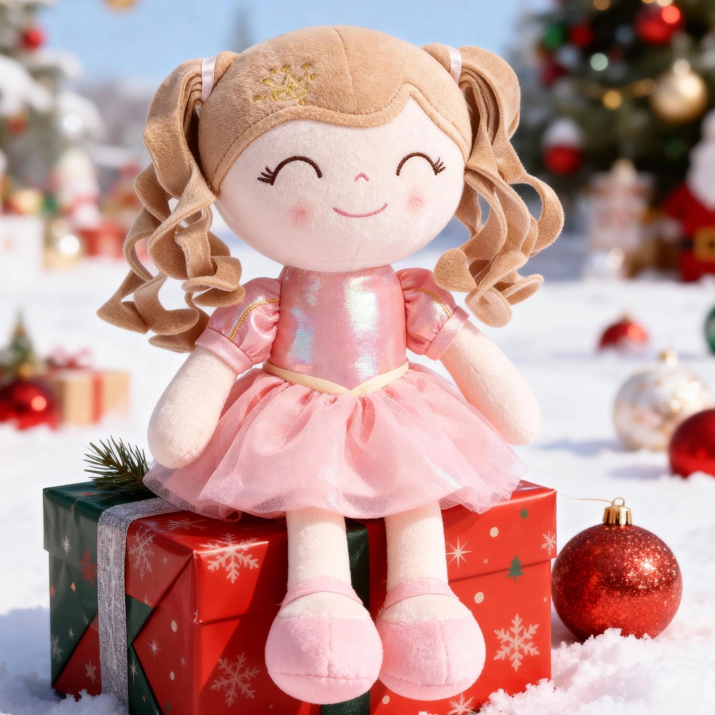 une doudou fille poupée assise sur un cadeau de Noël