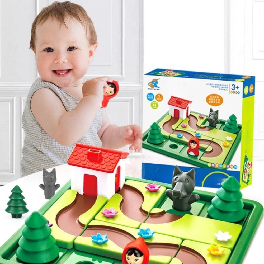 un bébé vient de prendre une pièce du jeu de logique le petit chaperon rouge