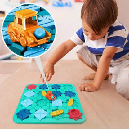 un gamin de 5 ans joue seul à son jeu de logique à défis pour trouver et réparer les routes en chantier de construcution.