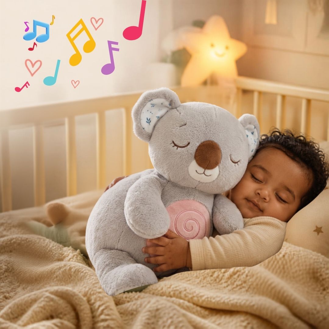 joli  gamin s'endort avec bébé koala qui respire dans les bras sous la douce musique de berceuse