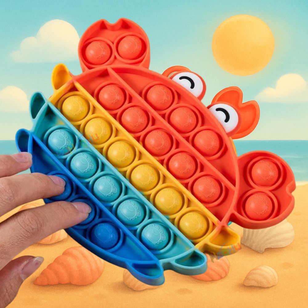 un pop it sur la plage en forme de crabe coloré