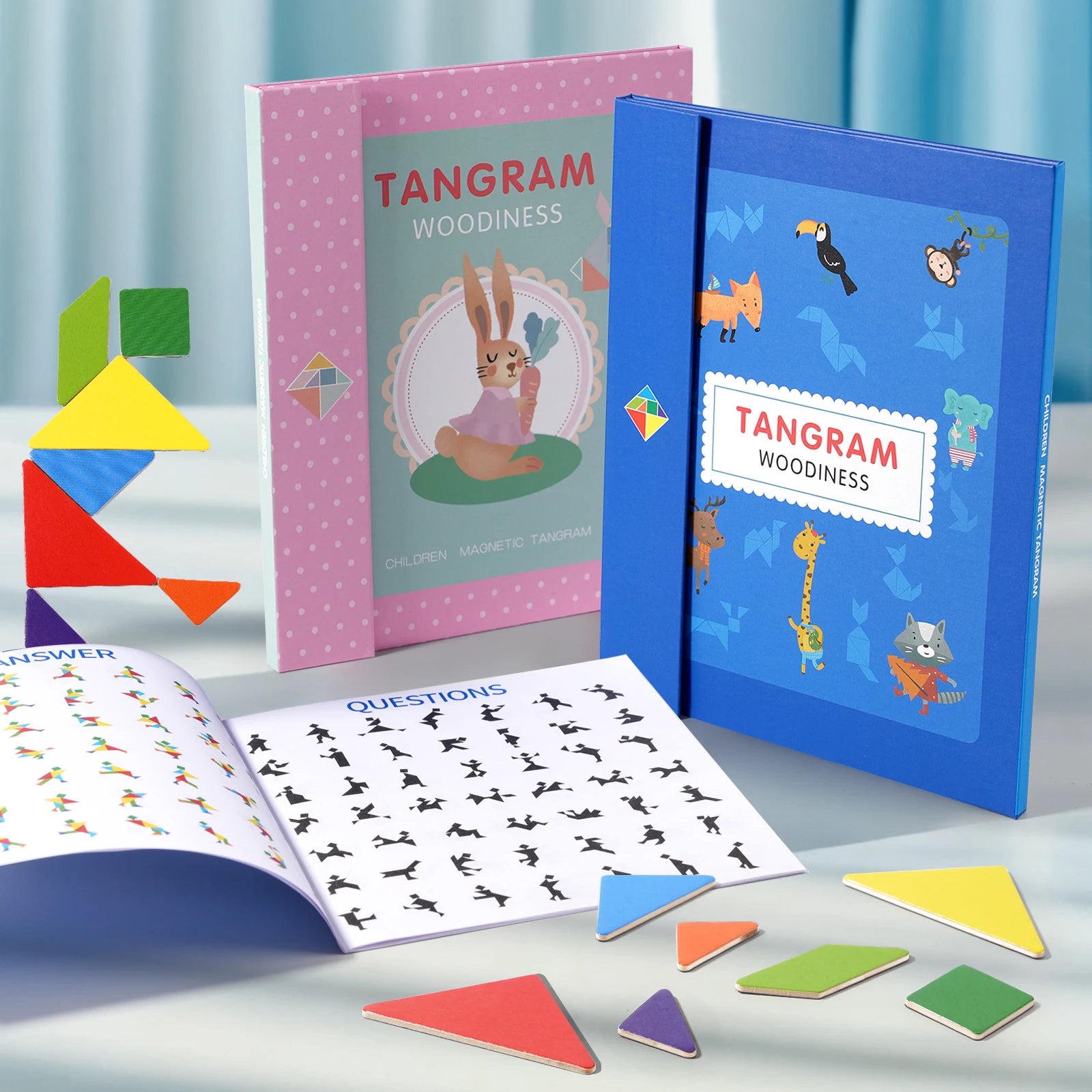 2 versions du jeu ancestral tangram Montessori la table avec le livre des déis et solutions ouverts en démonstration